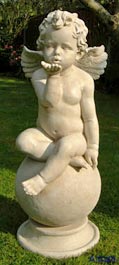 Cherub on Ball Blowing Kiss