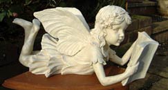 Angel Lying Down Reading Book
