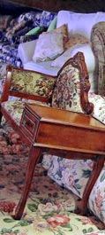 Padded chair with side table